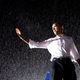 Then-candidate Barack Obama waving during a rally in the rain 2008.